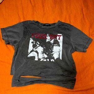 Dark grey wash crop top, says “tour 1977”